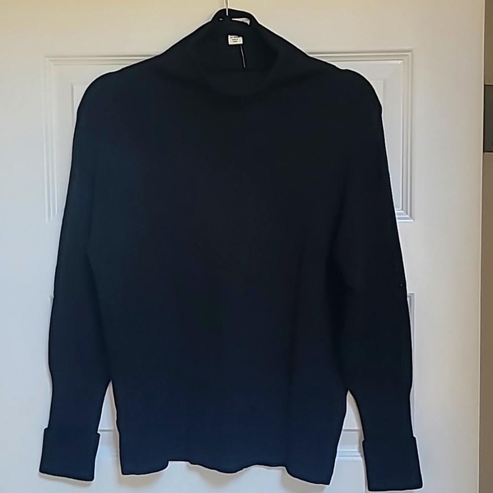 Black knit sweater.  Ivory version, too.